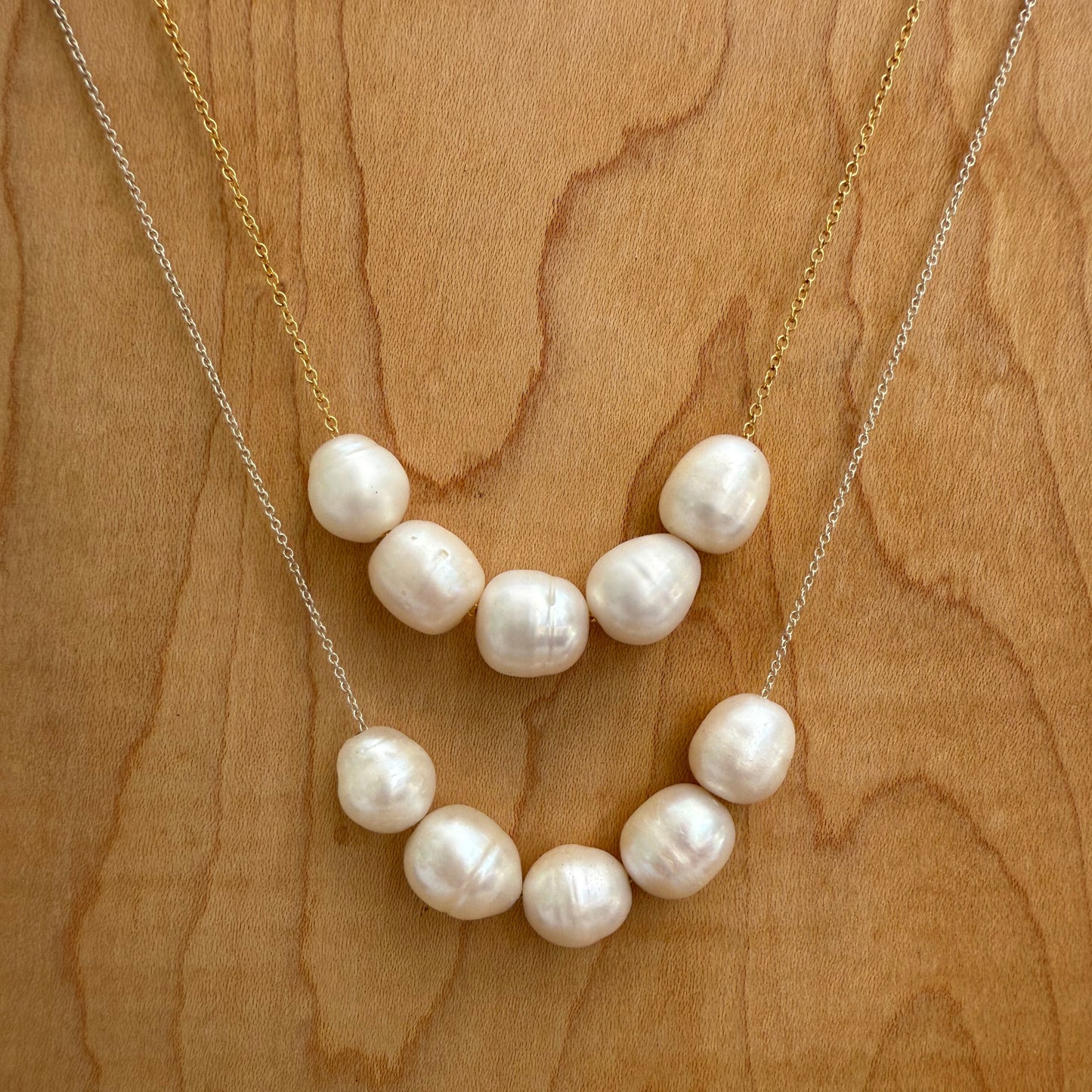 Pearl necklace on a wooden surface