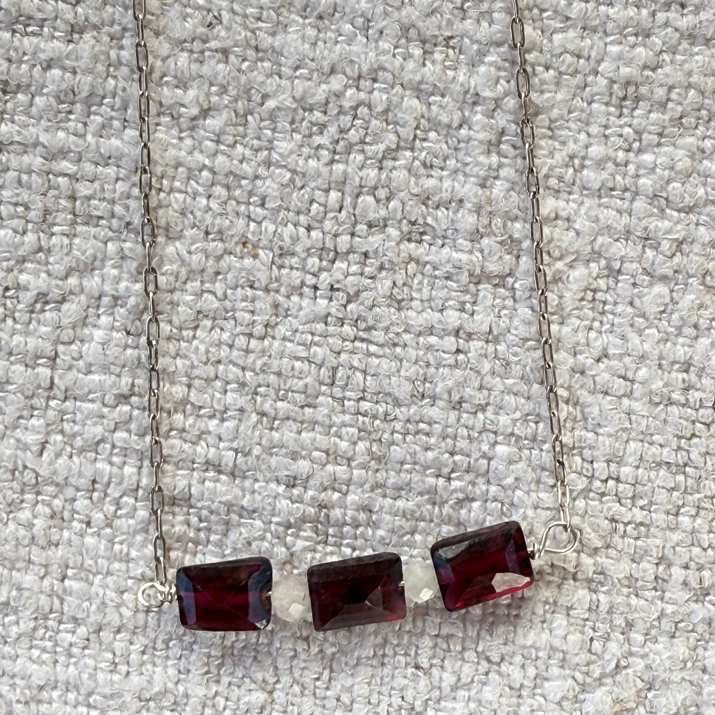 Three garnet baguettes on sterling silver chain