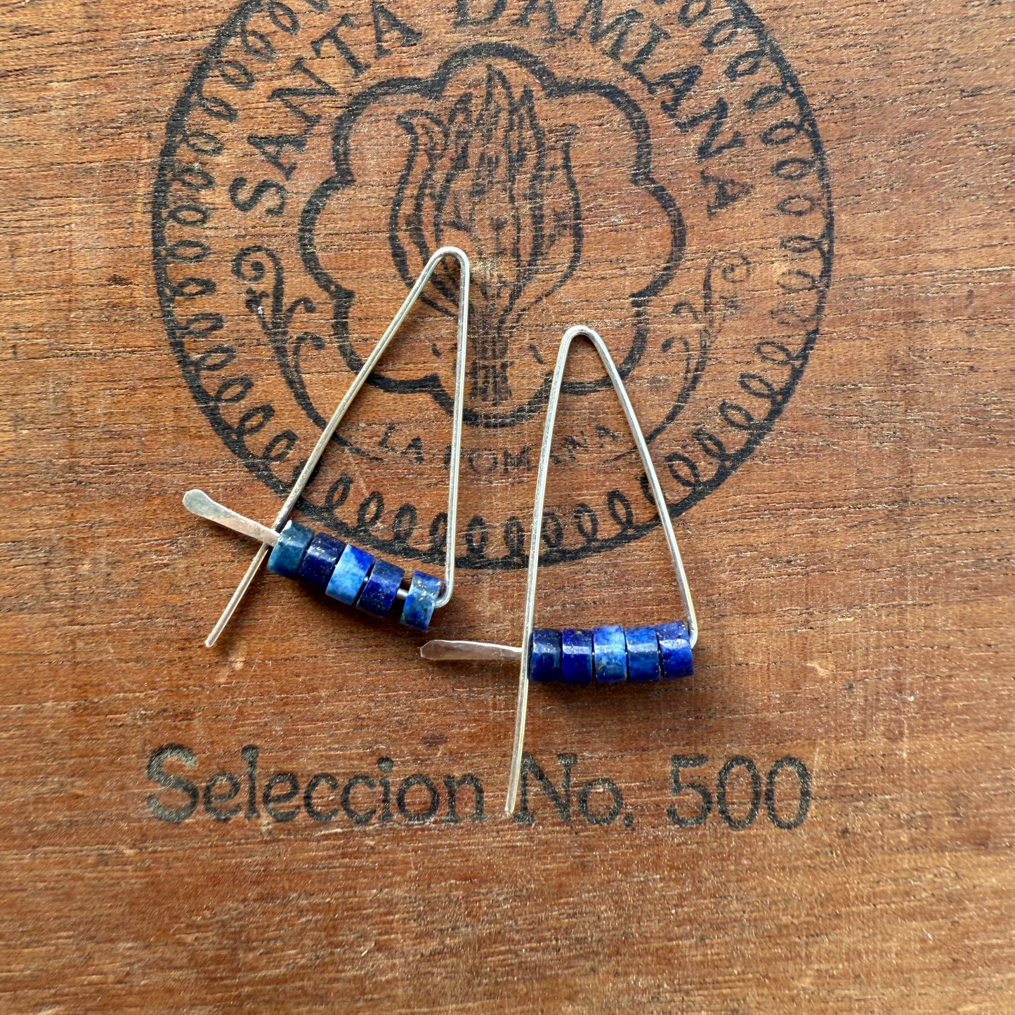 Enhebradores triangulares