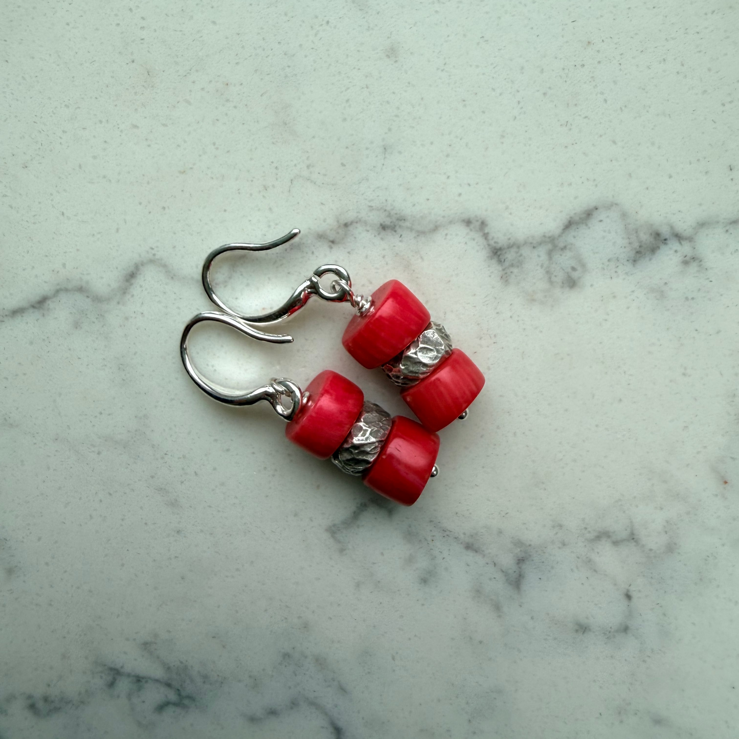 Double stack coral beads with Thai silver spacer between on silver ear wires